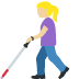woman with white cane: medium light skin tone emoji