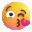 face blowing a kiss